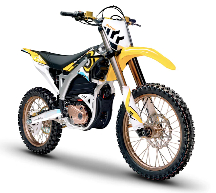 Sur-Ron Storm Bee Sur Ron Storm Bee electric dirt bike in motion on a forest trail, rider leaning into a turn, dust kicking up. Dynamic off-road action shot.